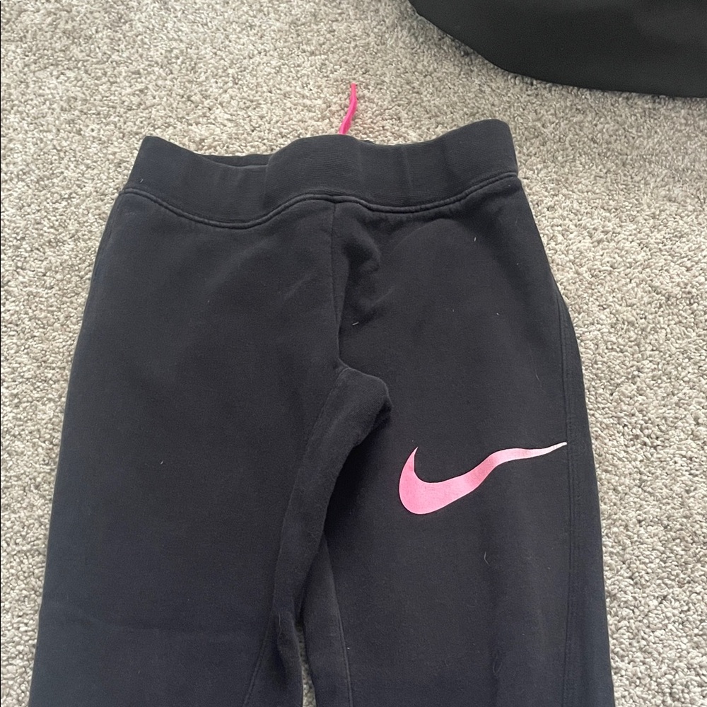 Nike Kids Black Joggers with Pink Swoosh